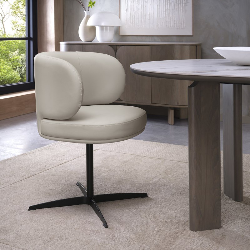 Marcel 360 Degree Swivel Dining Chairs - Ivory Faux Leather (Pair) by Bentley Designs Marcel 360 Degree Swivel Dining Chairs - Ivory Faux Leather (Pair) by Bentley Designs